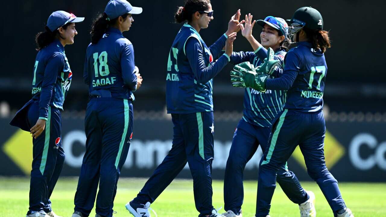 Sadia Iqbal of Pakistan (centre) celebrates with teammates after taking the wicket of Meg Lanning of Australia during the First T20I cricket match between Australia Women and Pakistan Women at North Sydney Oval in Sydney, Tuesday, January 24, 2023.