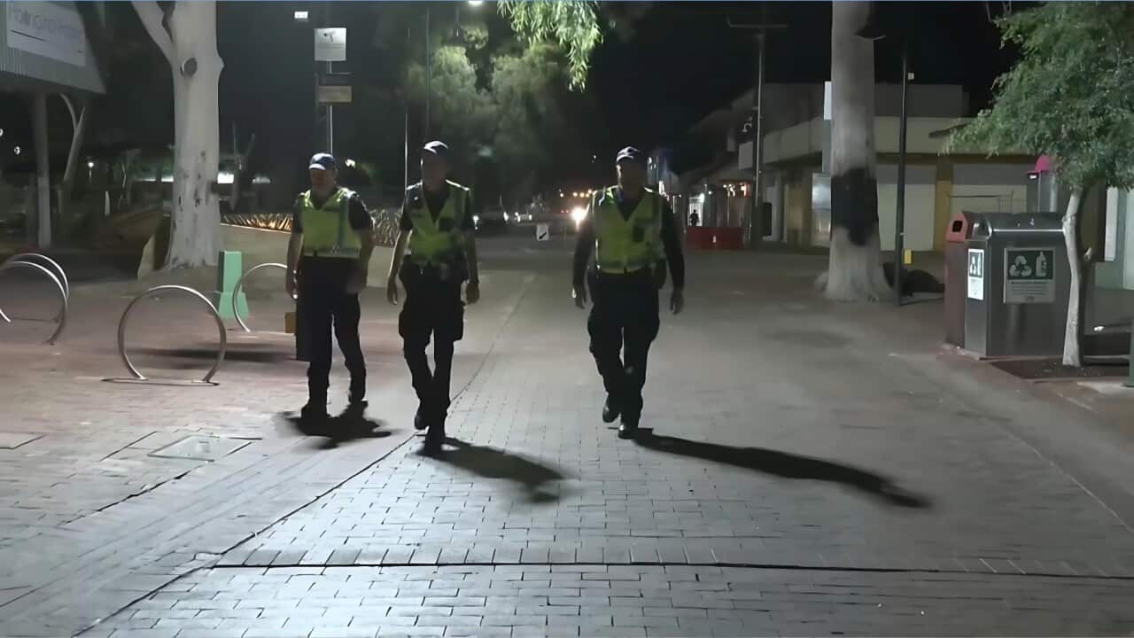 Police patrolling the deserted streets of Alice Springs during the curfew (SBS).jpg