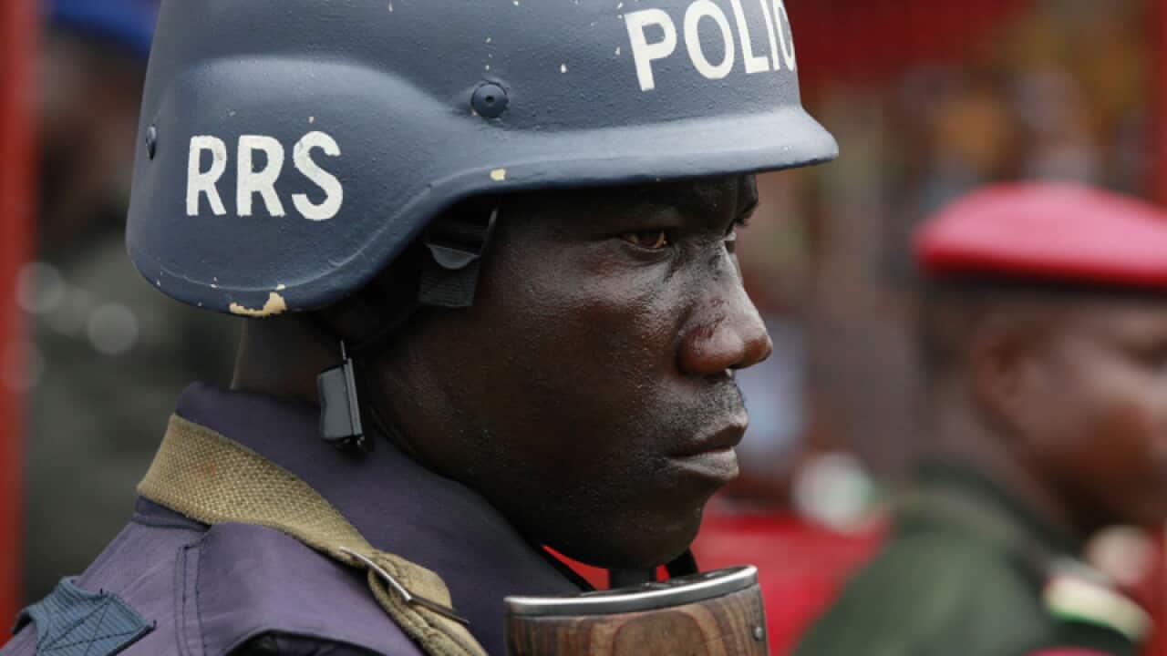 A police officer stand guards in Nigeria
