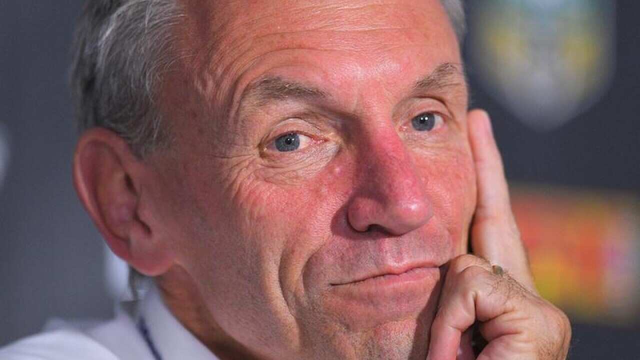 Titans coach Neil Henry speaks to the media