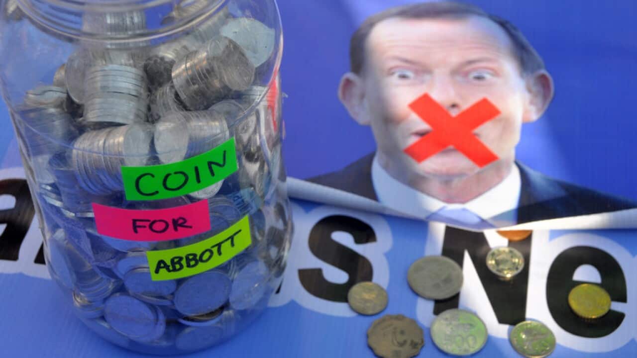 At a 'coin for Abbott' protest