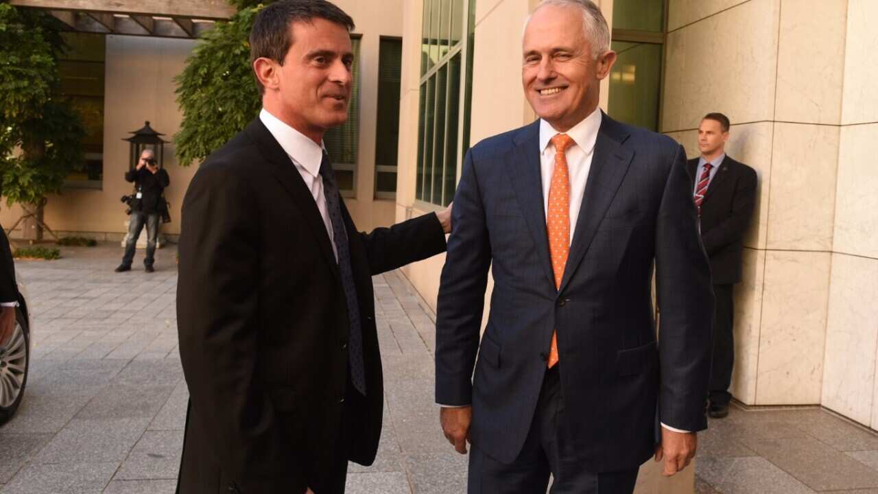 Australian Prime Minister Malcolm Turnbull (right) greets French Prime Minister Manuel Valls