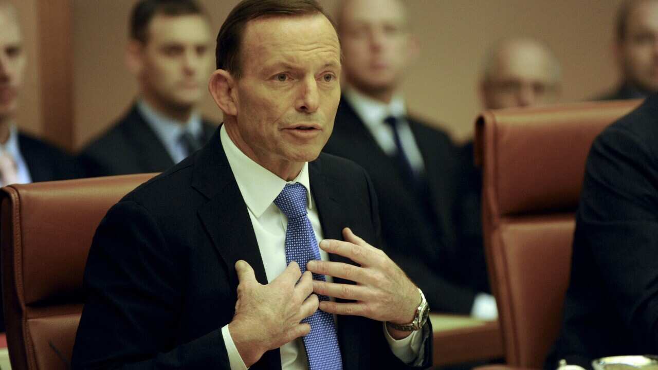 The Greens have labelled Tony Abbott an international embarrassment after the prime minister postponed a trip to Bali