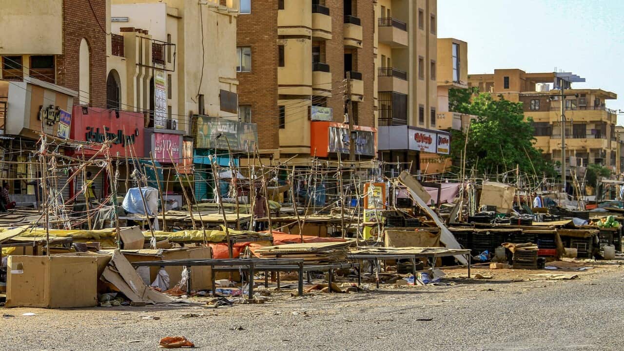 Stalls are abandoned in a street market in the south of Khartoum as fighting continues