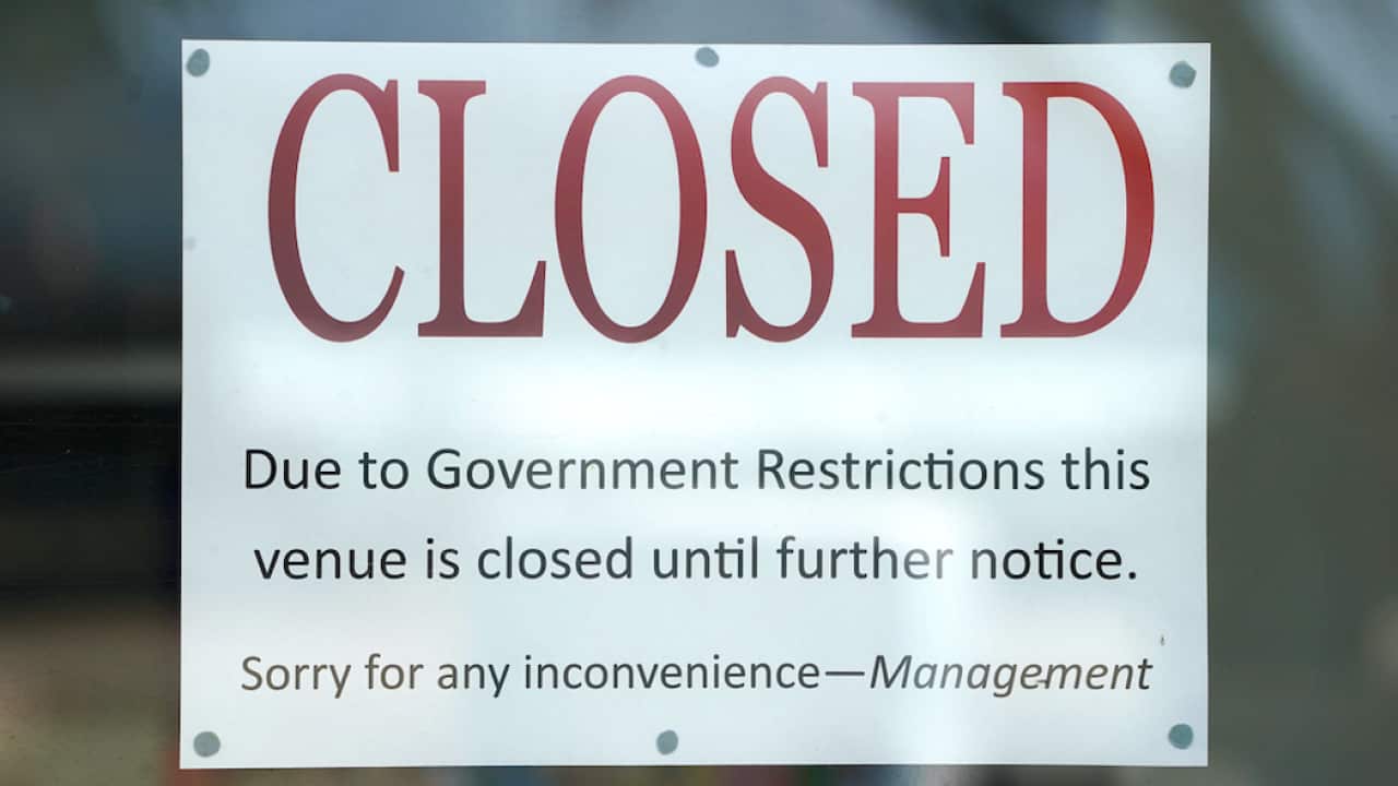A closed sign is seen at Surfers Paradise business on the Gold Coast, Wednesday, April 8, 2020.