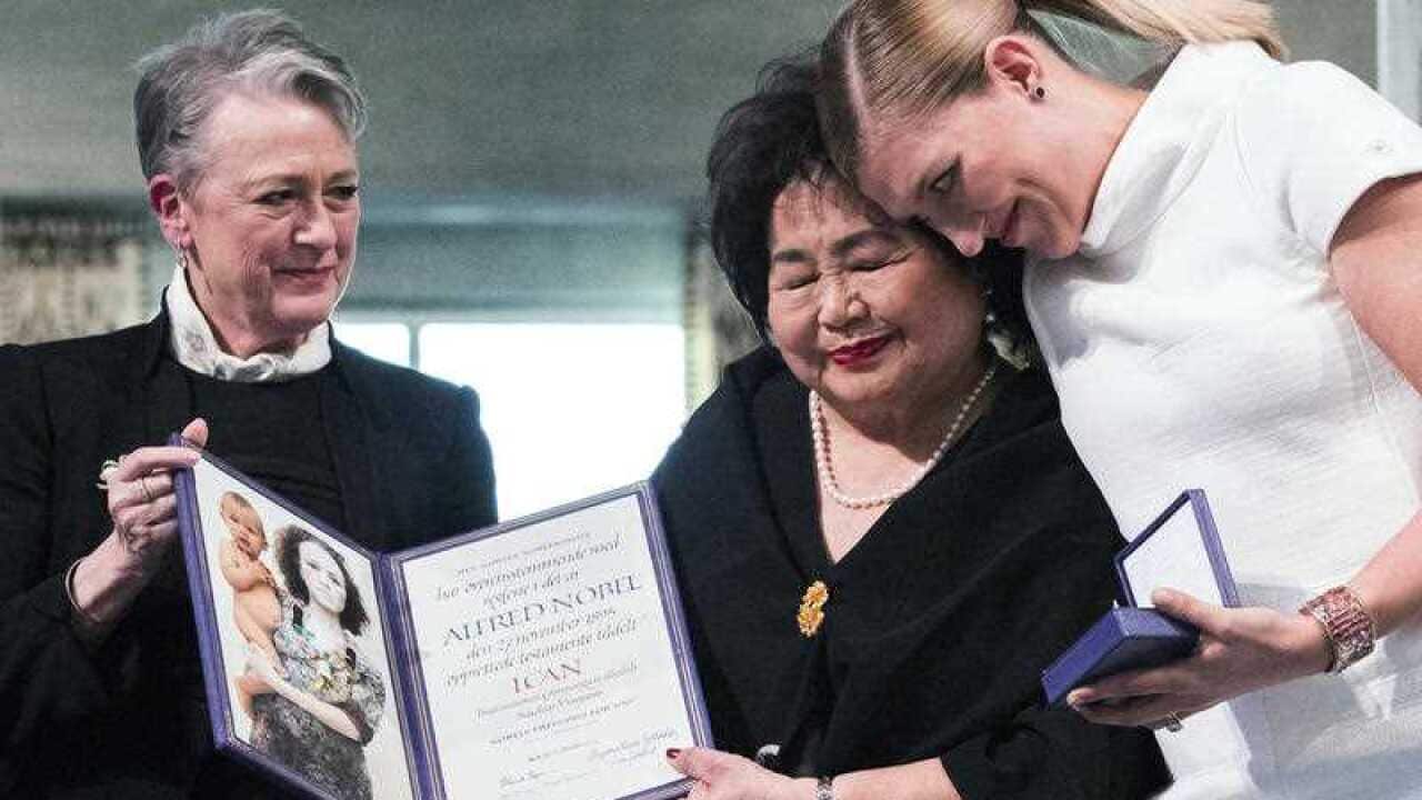 Leader of the Nobel committee Berit Reiss-Andersen, left, presents the award to Hiroshima Survivor Setsuko Thurlow and Beatrice Fihn, leader of ICAN