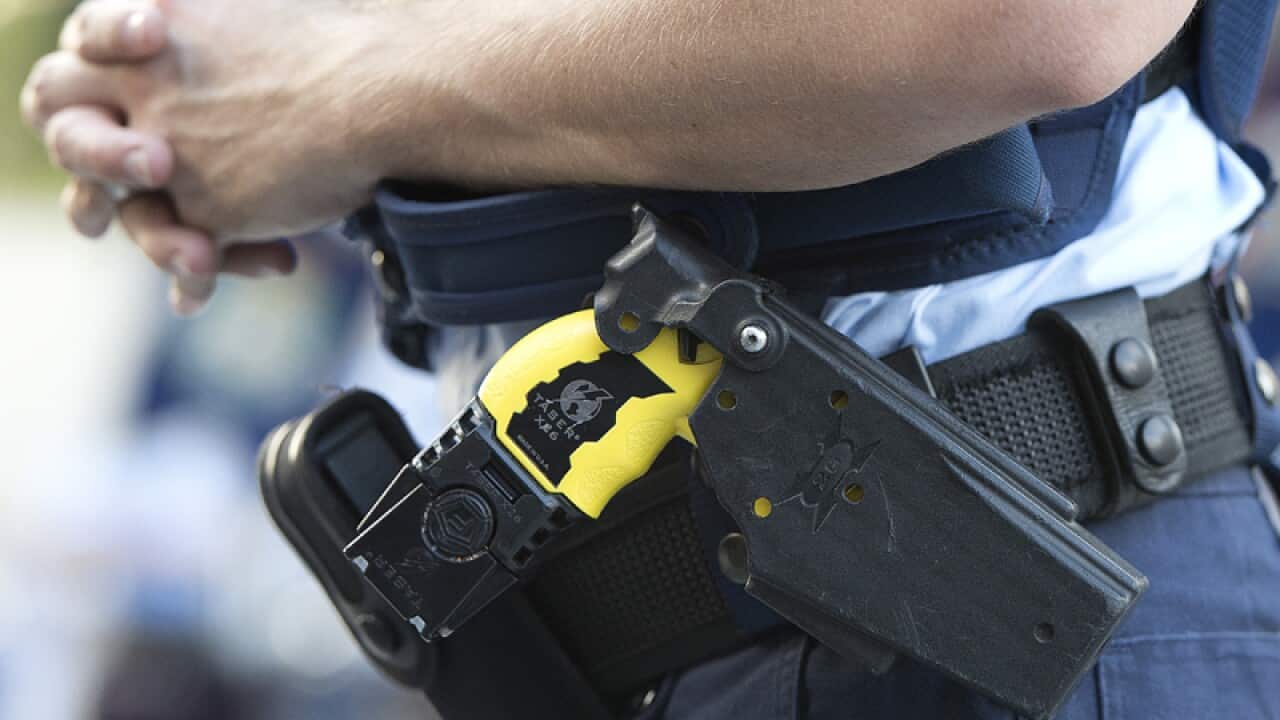 Police Officer wearing a Taser
