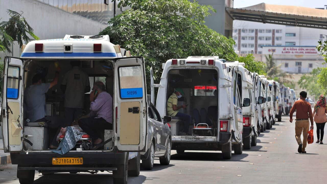 Ambulances carrying COVID-19 patients line up waiting for their turn to be attended at a dedicated COVID-19 government hospital in Ahmedabad, India.