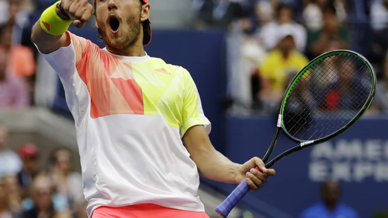 Lucas Pouille reacts after breaking serve against Rafael Nadal