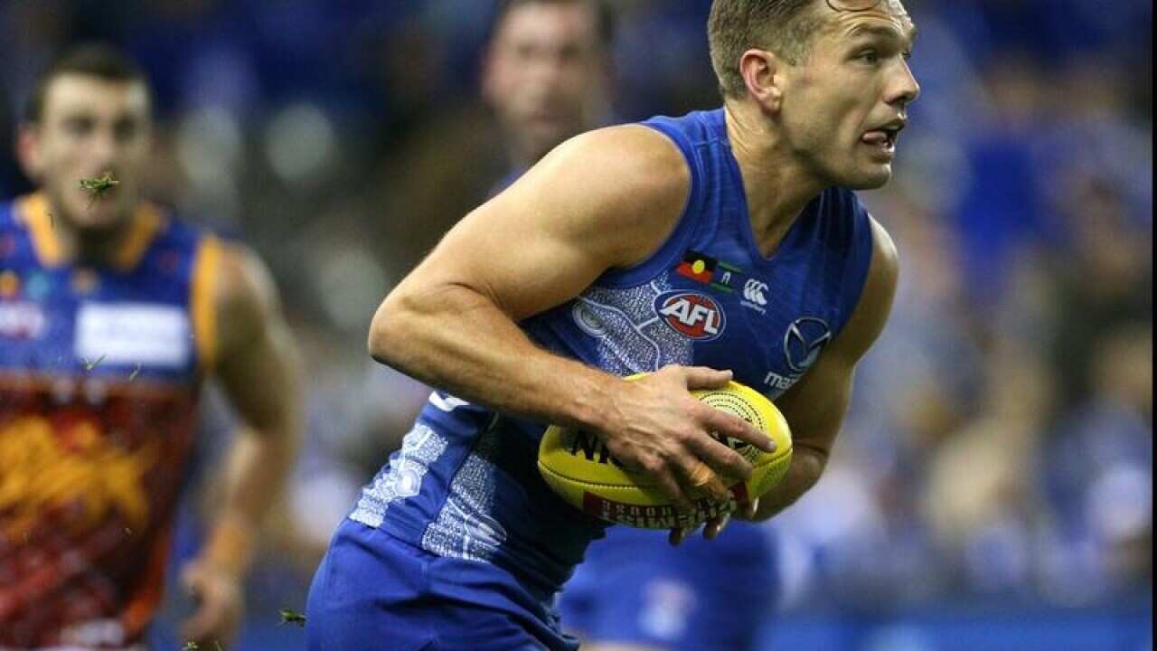 Shaun Higgins of the Kangaroos in action against Brisbane.