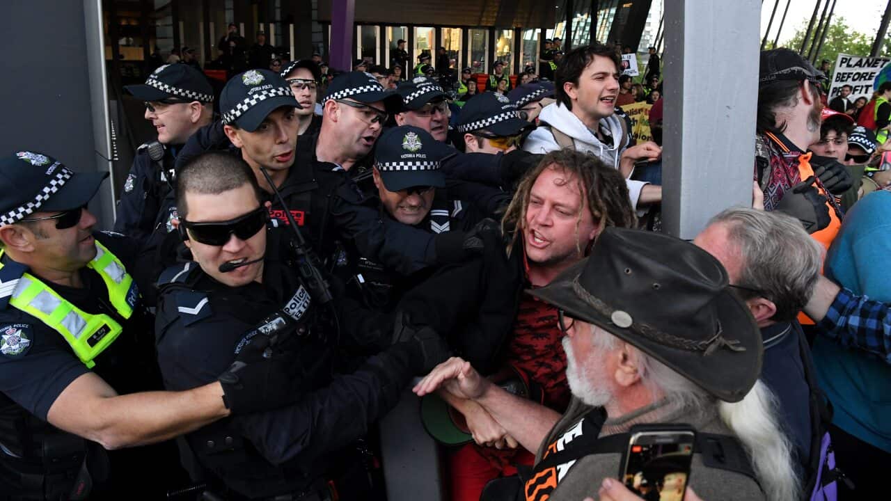 Environmental protesters clash with Police outside the Melbourne Exhibition and Convention Centre in Melbourne.