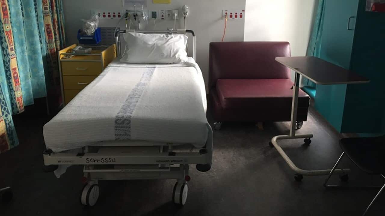 An empty hospital bed