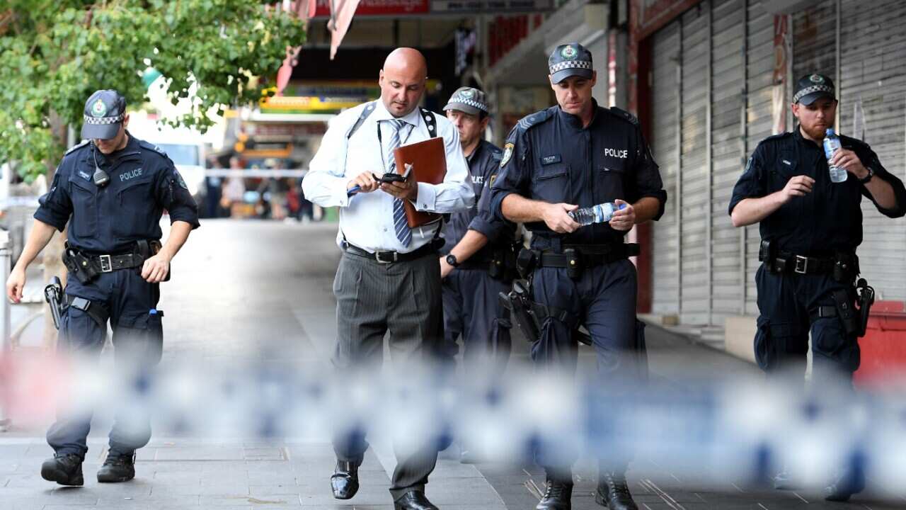NSW Police attend the scene of a shooting at a cafe at Bankstown City Plaza, in Bankstown, Tuesday, January 23, 2018. 