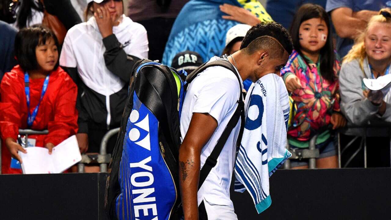 Nick Kyrgios leaves the court