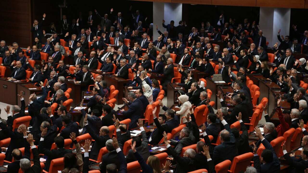 Members of Turkish parliament vote at the Grand National Assembly of Turkey (TBMM) in Ankara,Turkey, 02 January 2020. The Turkish Parliament met extraordinary to vote on authorization to send Turkish forces to Libya. EPA/STR