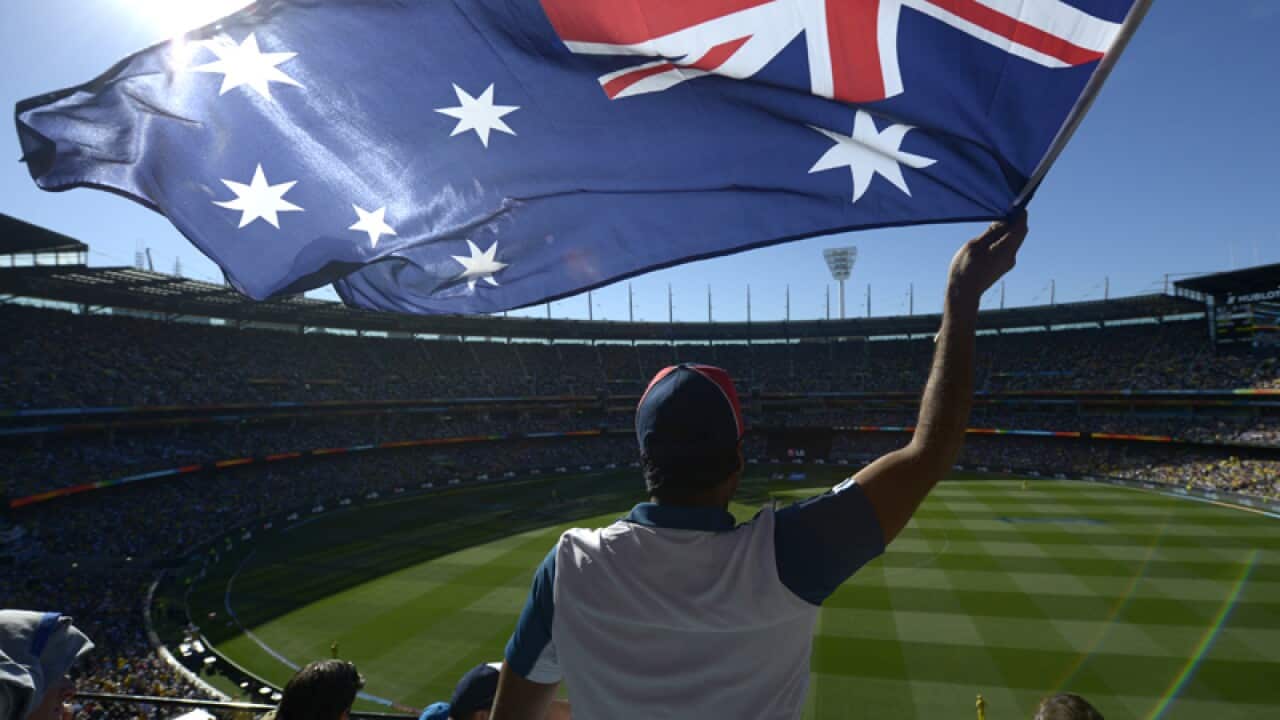 An Australian fan waves a flag during the 2015 ICC World Cup cricket