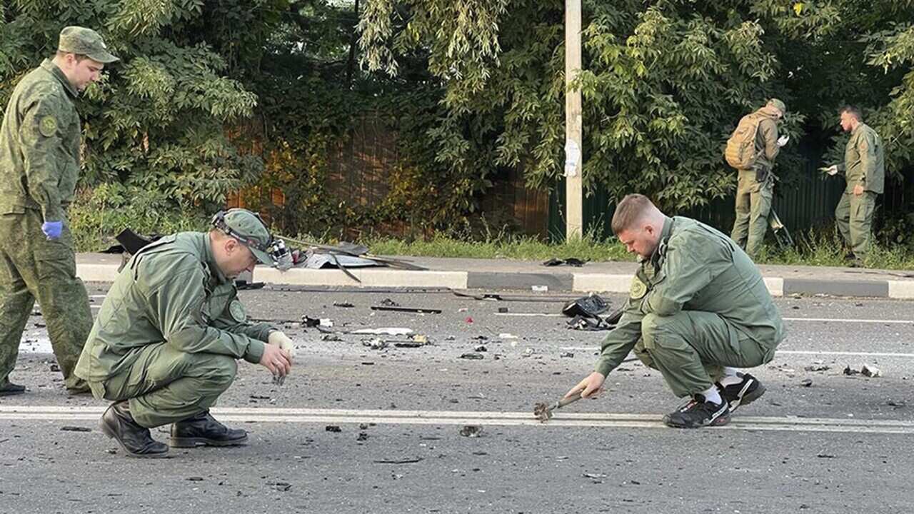Investigators on the site of the explosion (AAP).jpg