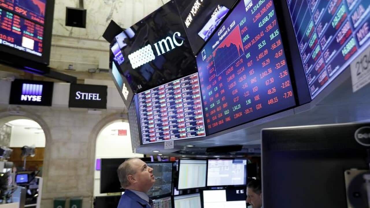 A trader on the floor of the New York Stock Exchange on Monday.