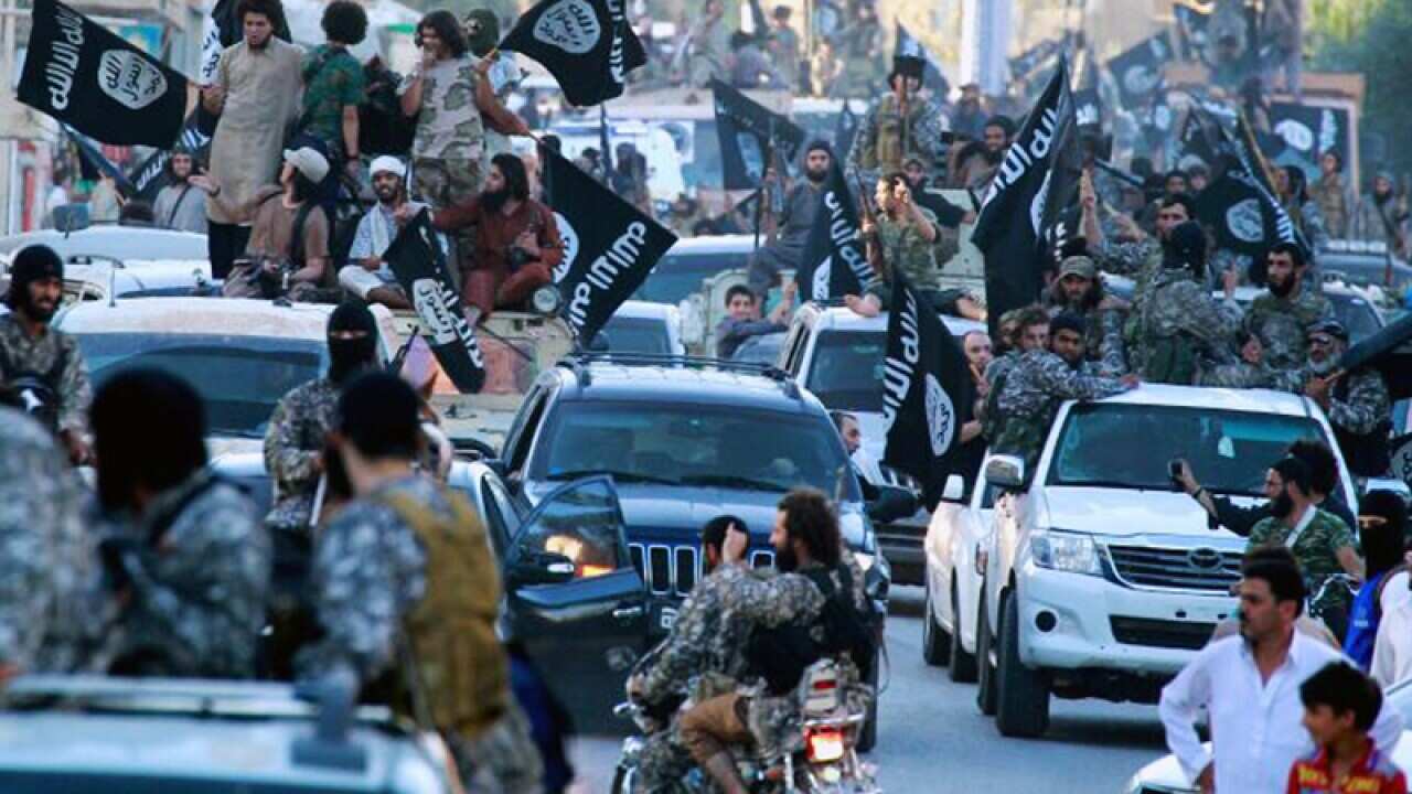 Fighters from extremist Islamic State group during a parade in Raqqa