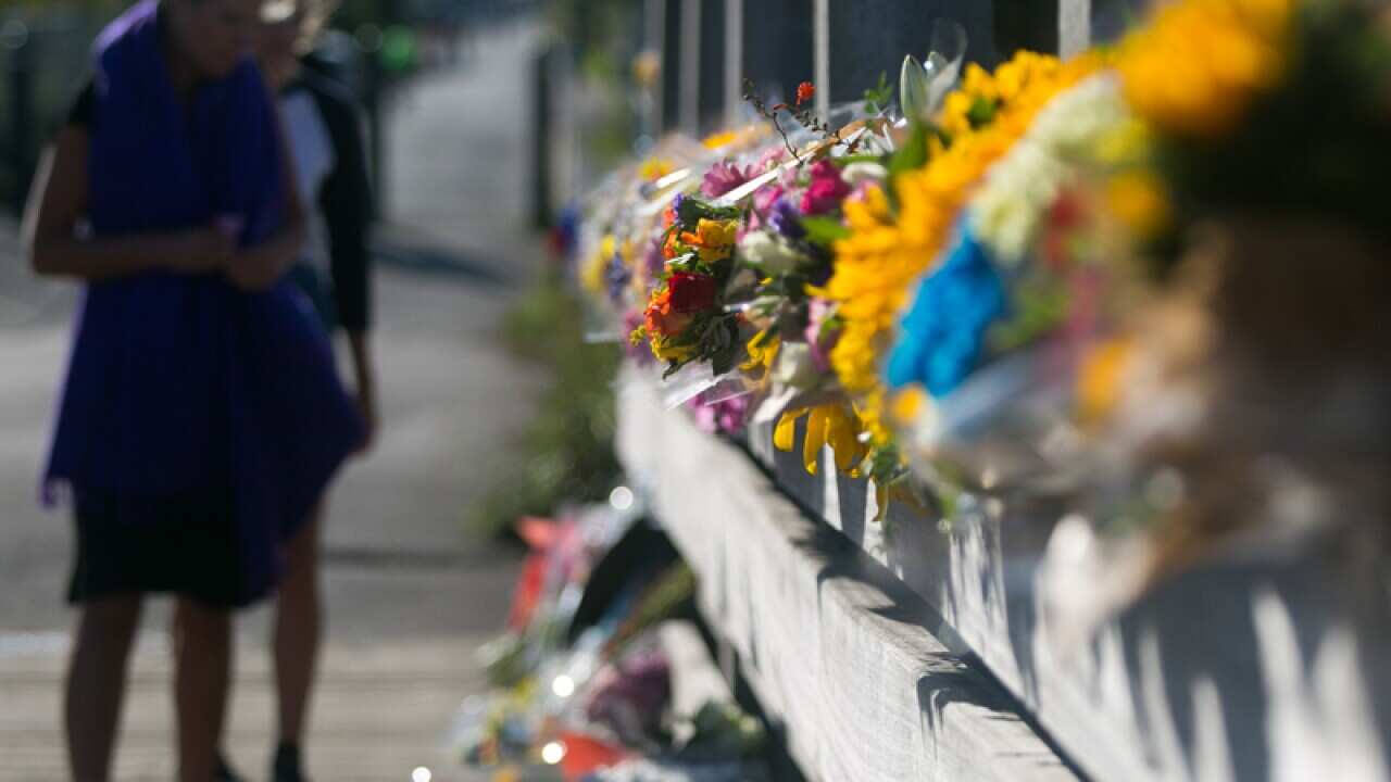 Flowers laid on the Shoreham Tollbridge that crosses the River Adur