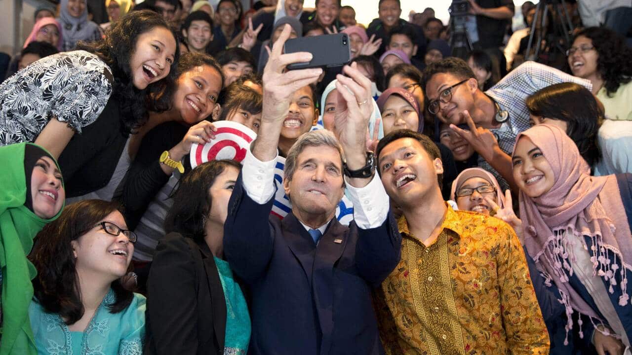 US Secretary of State John Kerry takes a photo with a group of students in Jakarta - AAP-1.jpg