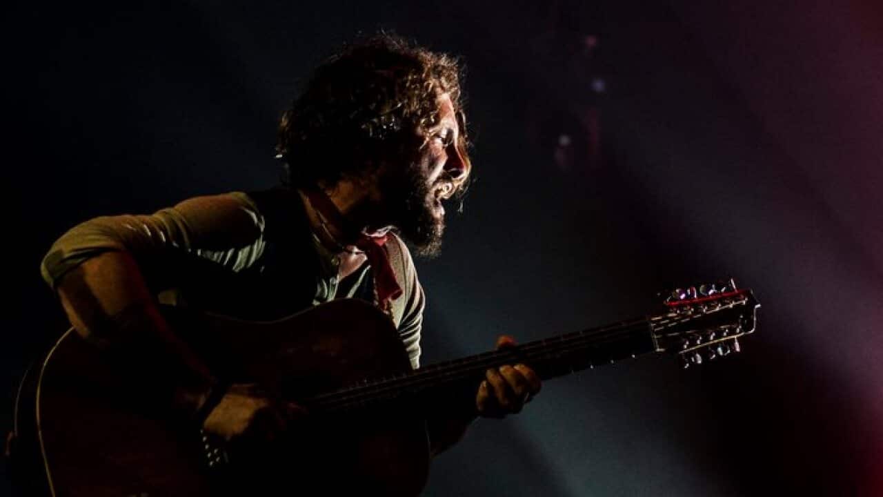 epa04172752 John Butler, lead vocalist and guitarist from the John Bulter Trio, performs on stage at the 25th Bluesfest in Byron Bay, Australia, 19 April 2014. Australia's premier blues and roots music festival runs from 17 to 21 April.  EPA/KABIR DHANJI