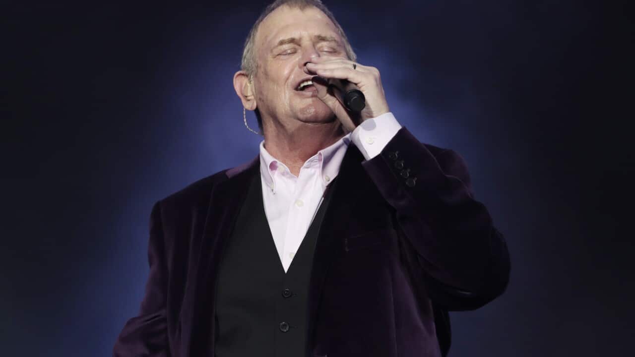John Farnham singing on stage