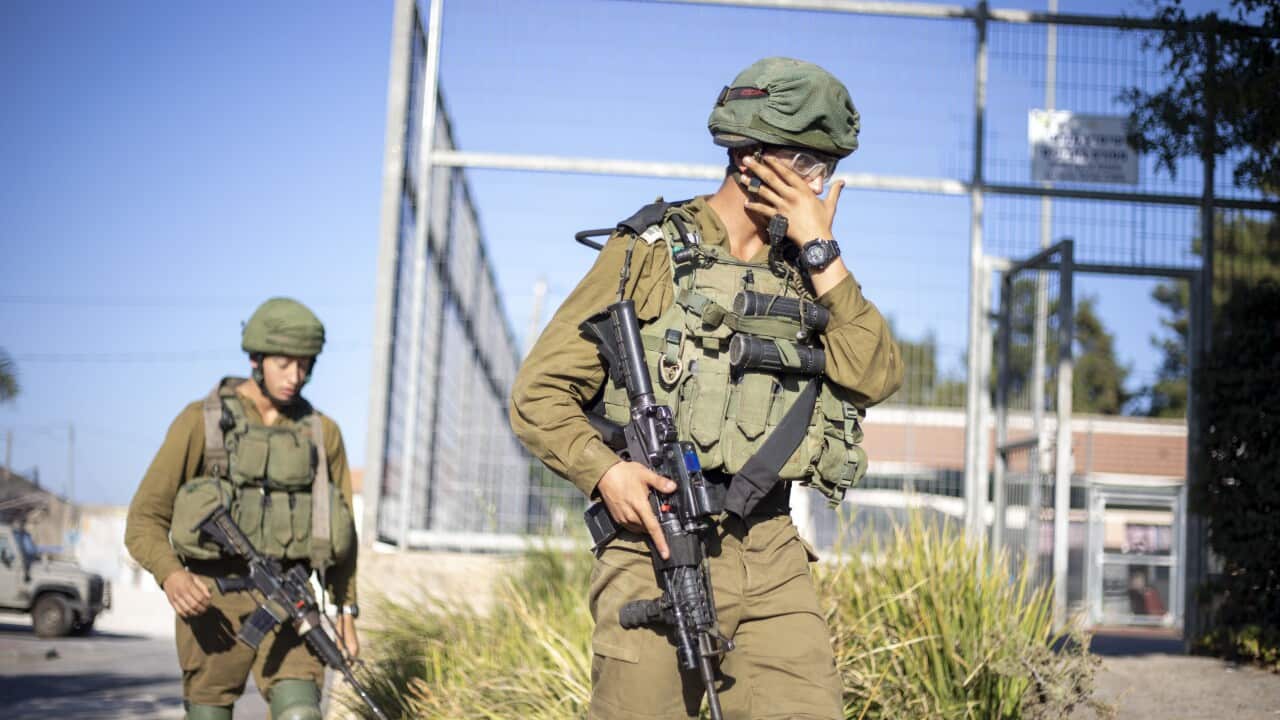 Israeli soldiers secure the village of Avivim on the Israel-Lebanon border