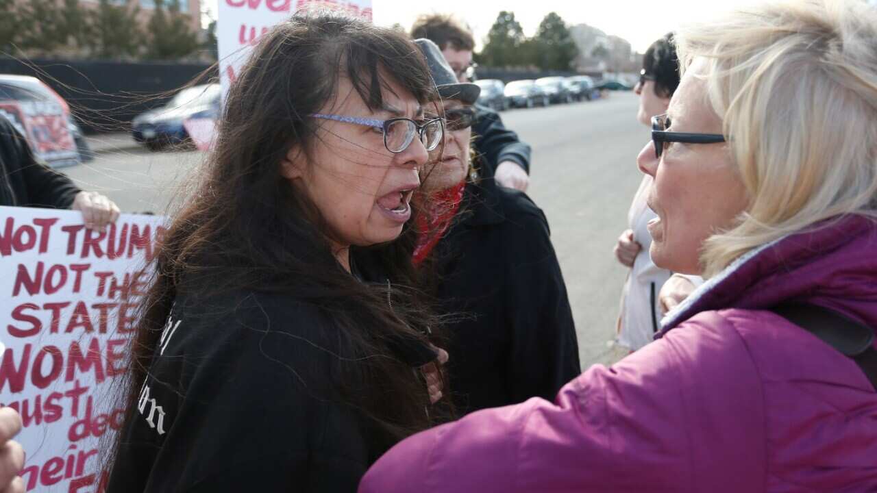 Pro-choice demonstrator Brenda Zee, left, confronts anti-abortion activist Susan Sutherland, of Colorado Right to Life