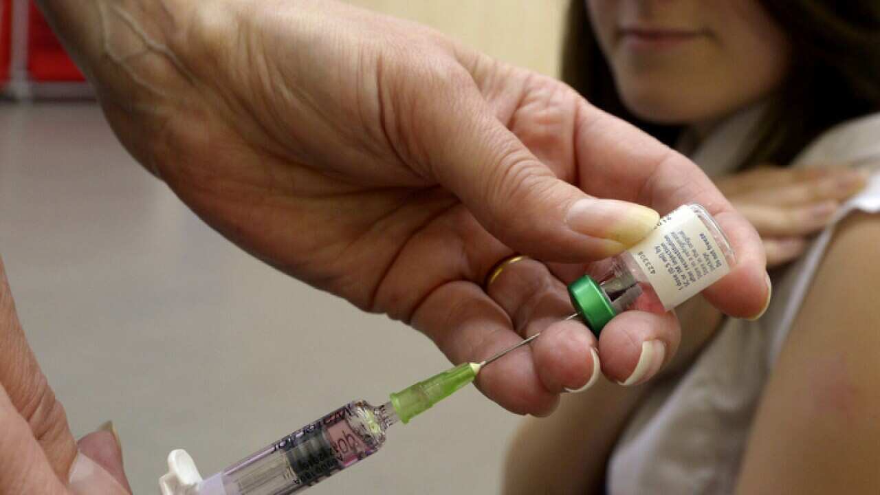 Woman prepares for a needle
