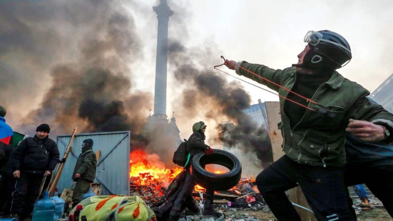 A protester uses a catapult during clashes in downtown Kiev