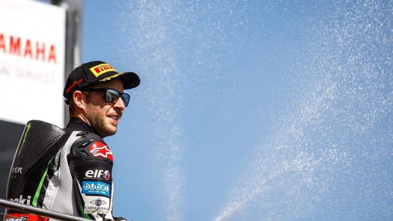 Jonathan Rea celebrating his victory by spraying bubbles.