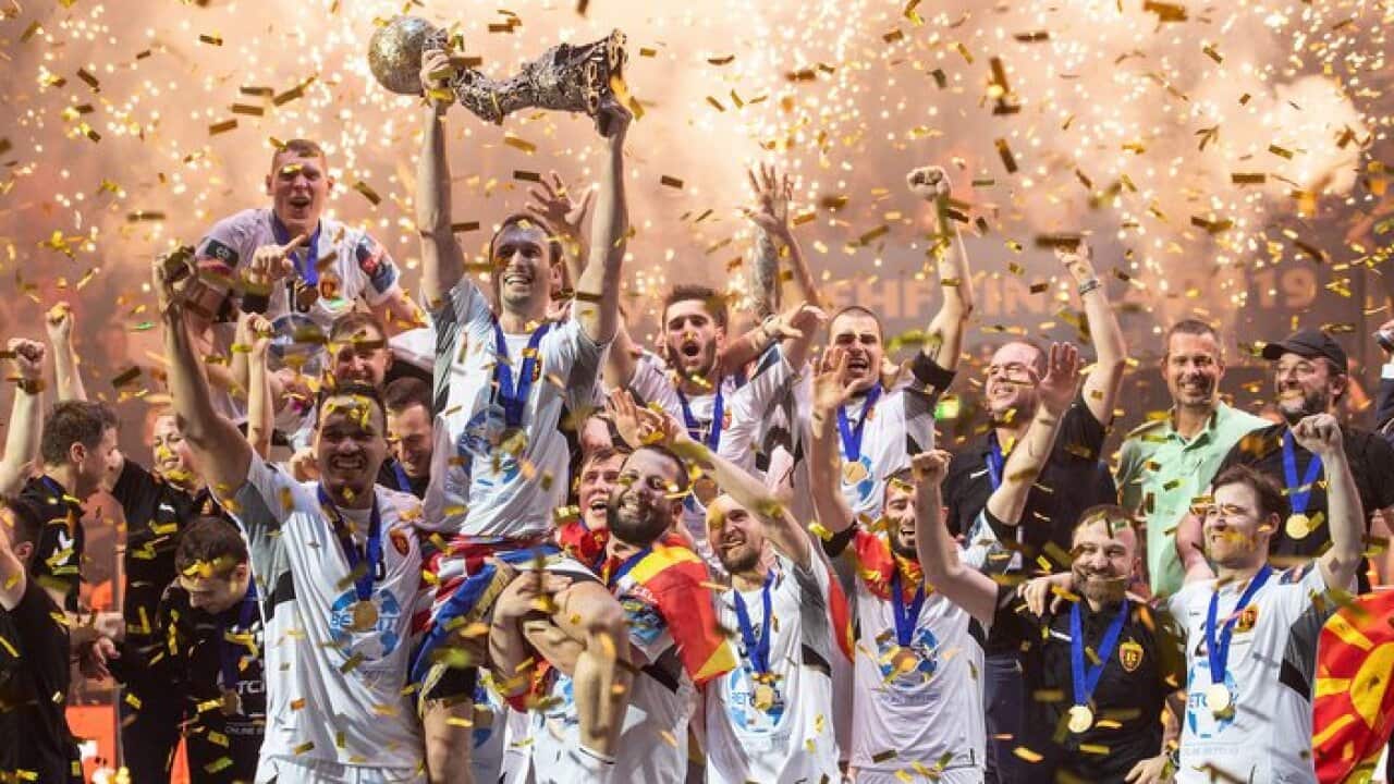 02 June 2019, North Rhine-Westphalia, Cologne: Vardar's Igor Karacic holds up the trophy after winning the EHF Champions League final Handball match between Vardar Skopje and Telecom Veszprem. Photo: Marius Becker/dpa