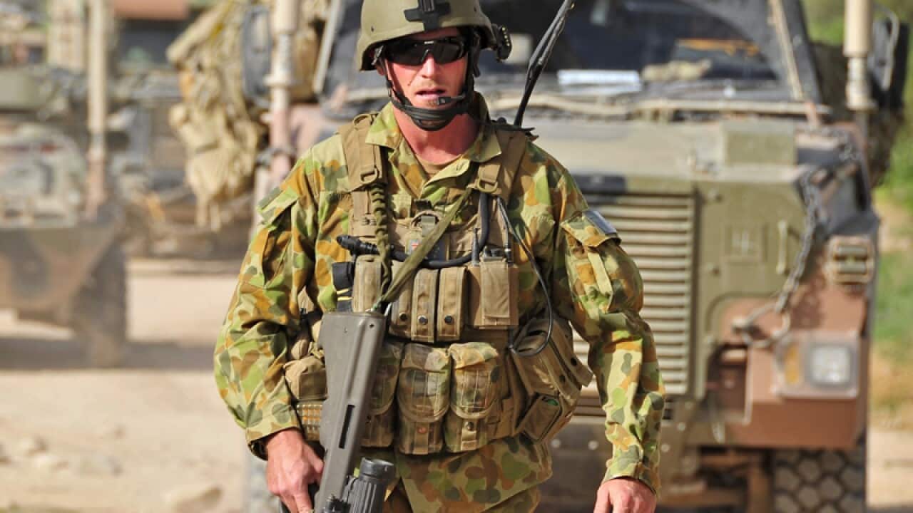 A soldier at a checkpoint in the Mirabad Valley region