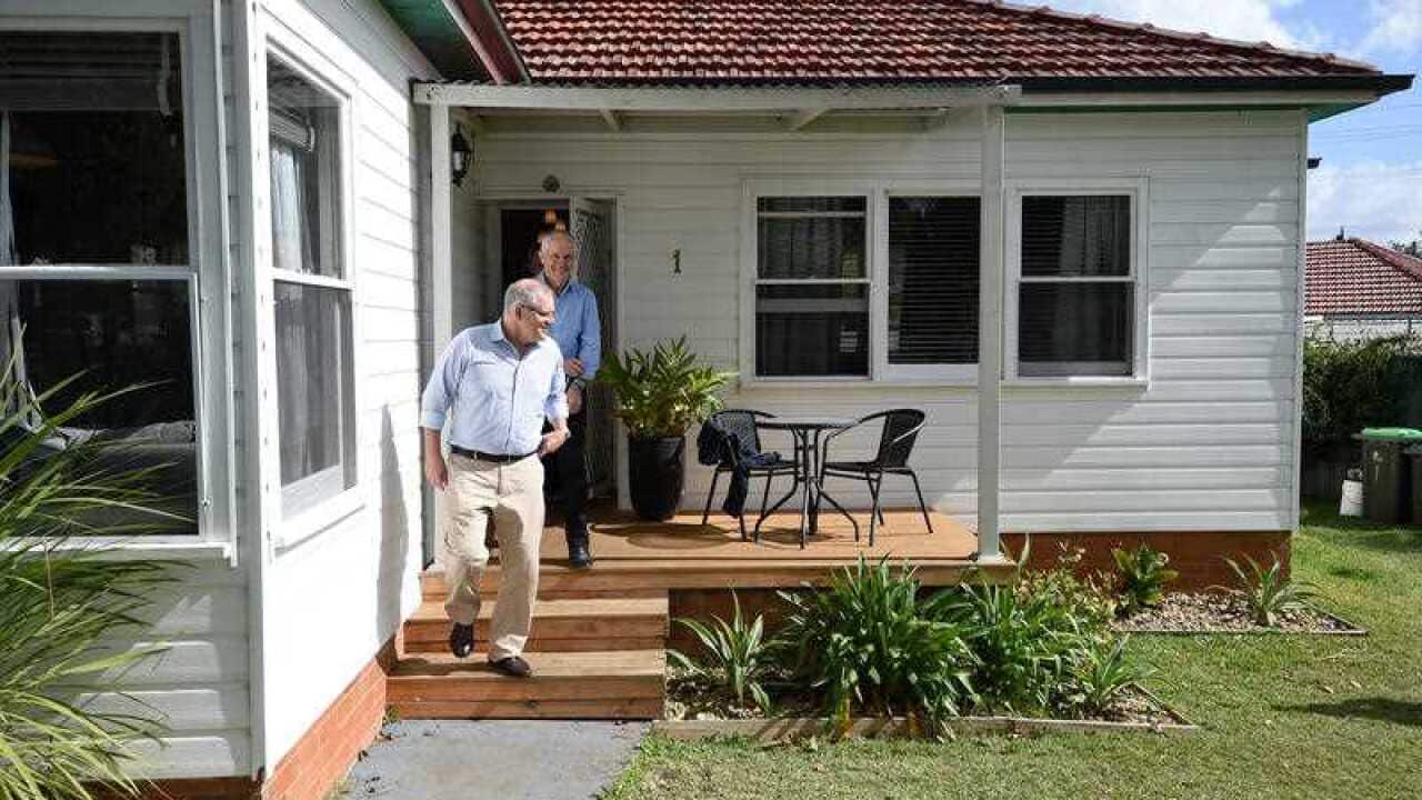 Prime Minister Malcolm Turnbull, along with Treasurer Scott Morrison are seen after meeting with Julian and Kim Mignacca at their home in Penshurst, Sydney.