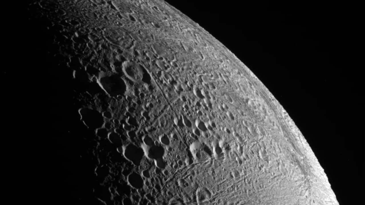 A close up view by the Cassini spacecraft of the Saturn moon, Enceladus' northern pole.
