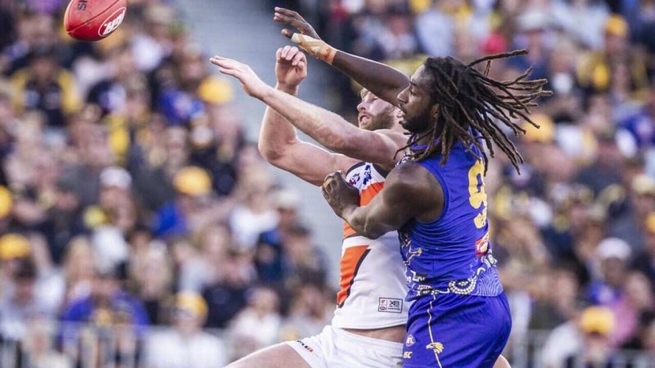 Dawson Simpson L) and Nic Naitanui contest the ball
