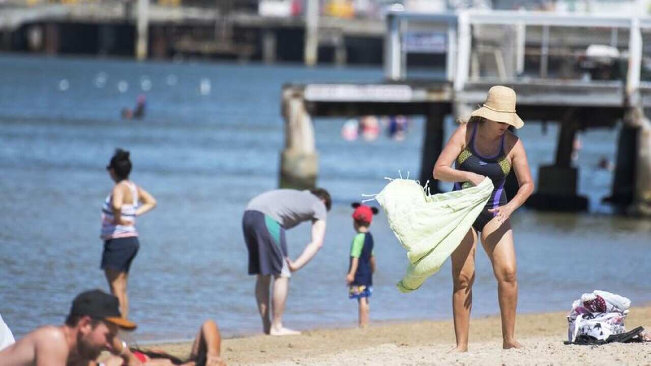 Mid morning beachgoers are seen at Port Melbourne beach