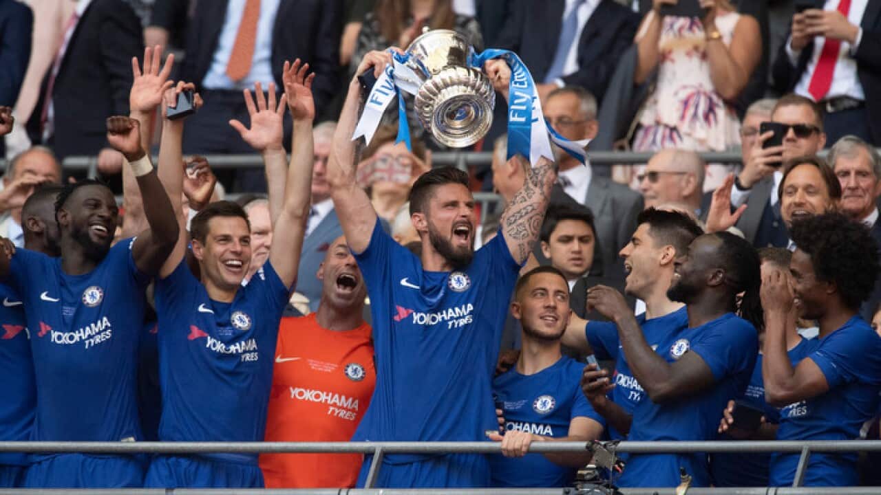 Chelsea's Olivier Giroud lifts the FA Cup.