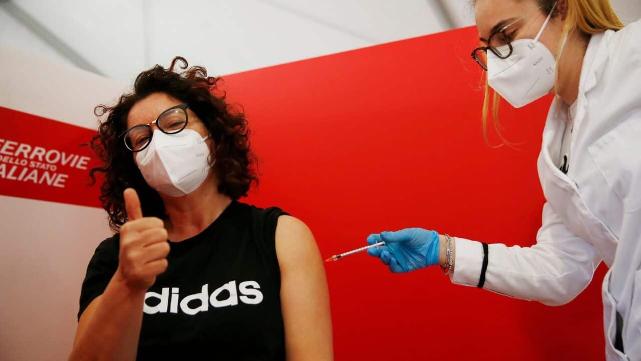 School workers are vaccinated at Roma Termini in Rome, Italy.