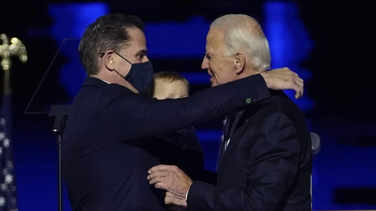 Joe Biden, right, embraces his son Hunter Biden, left, Saturday, Nov. 7, 2020, in Wilmington, Delaware