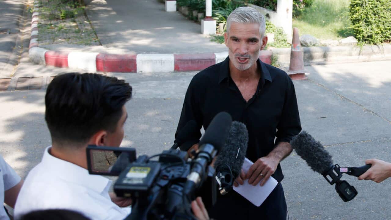 Former Socceroo Craig Foster talks to journalists after meeting detained athlete Hakeem al-Araibi