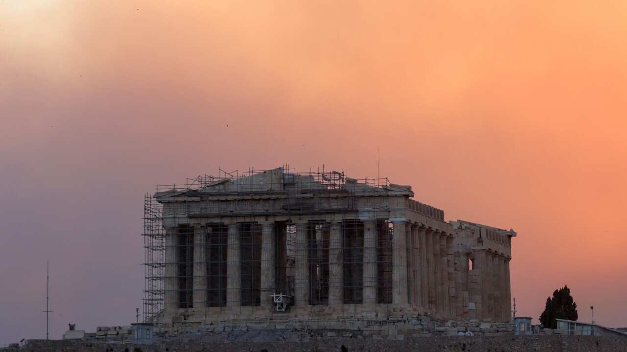 Smoke rises over Parthenon temple during a wildfire in Athens