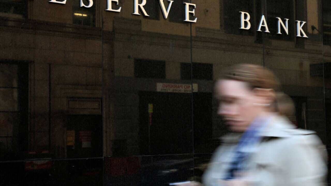 People walk past the Reserve Bank of Australia