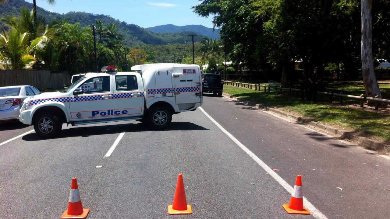 A police block at an address in Manoora near Cairns where up to eight victims have reportedly been stabbed to death in a far north Queensland (AAP)