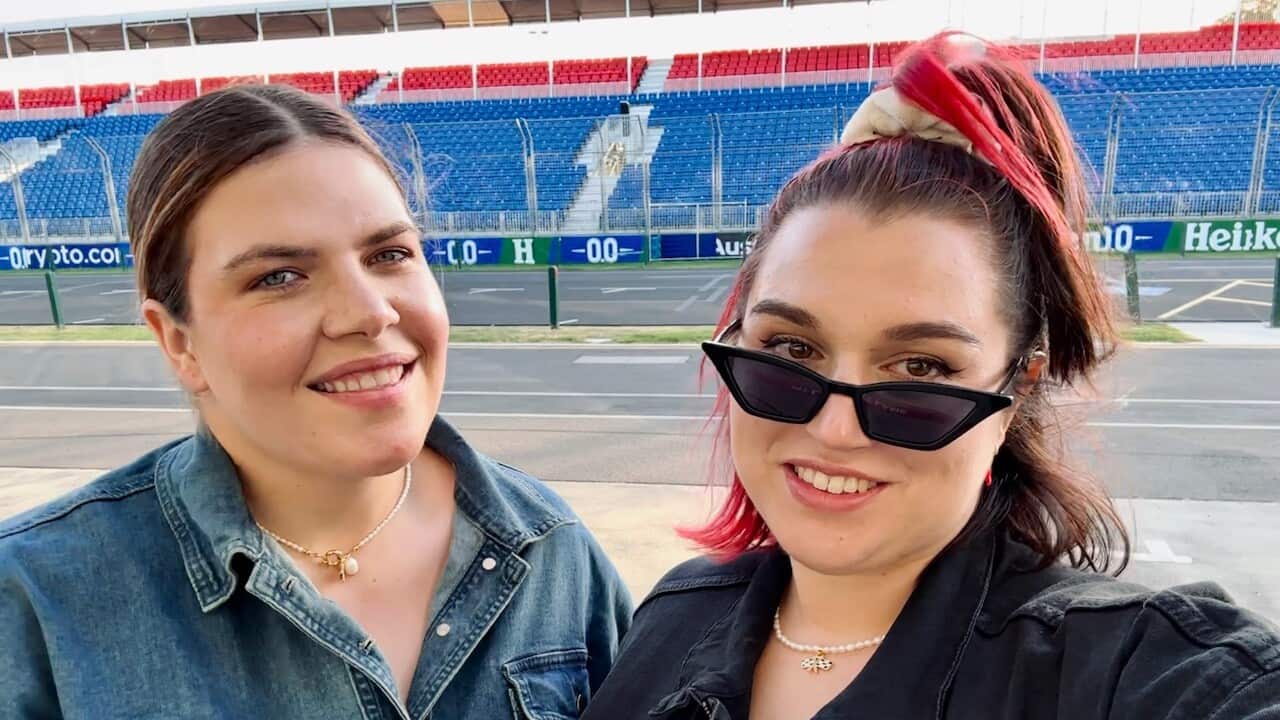 Two women smiling at the camera