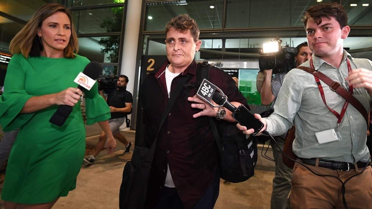 Bali Nine drug smuggler Renae Lawrence was pursued by media as she made her way to the terminal transfer bus.