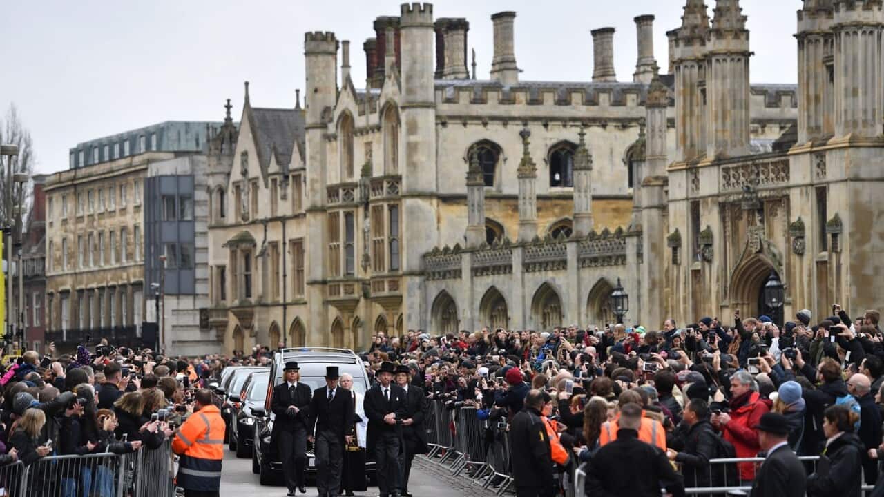 Thousands turn out for the funeral of Professor Hawking at the University Church of St Mary the Great in Cambridge.
