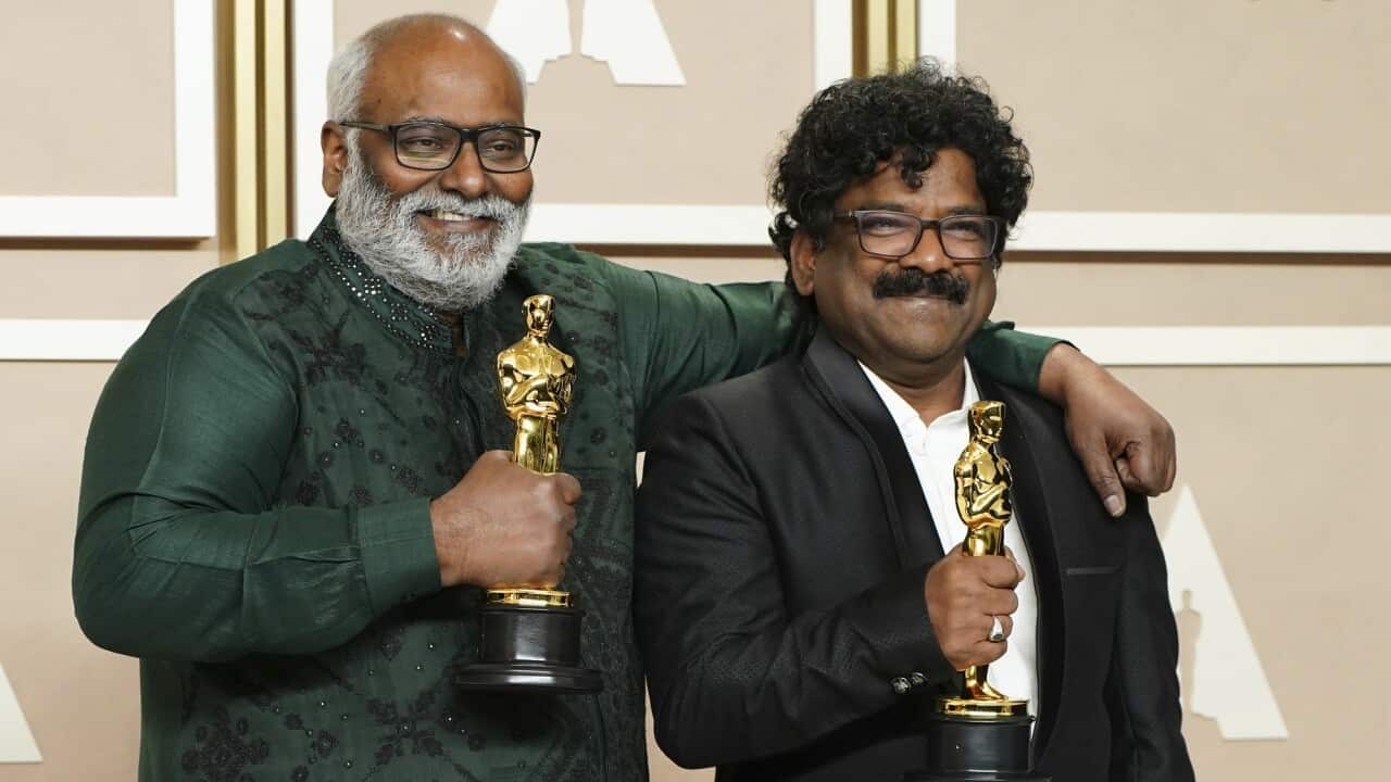 M.M. Keeravaani (left) and Chandrabose hold their prizes after winning the Oscar for best original song.