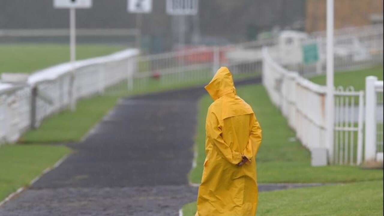 A groundsman is seen during a race meet in Gosford